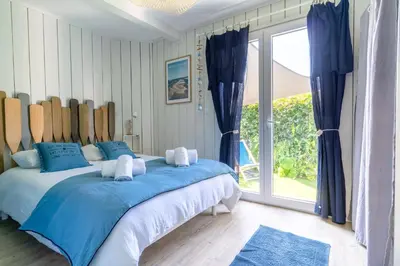 Un ou plusieurs lits dans un hébergement de l'établissement Mamy Blue - Maison proche Lac de Cazaux