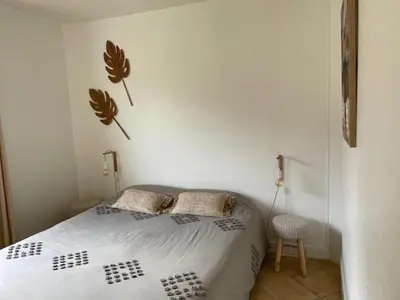 Un ou plusieurs lits dans un hébergement de l'établissement Chalet proche océan