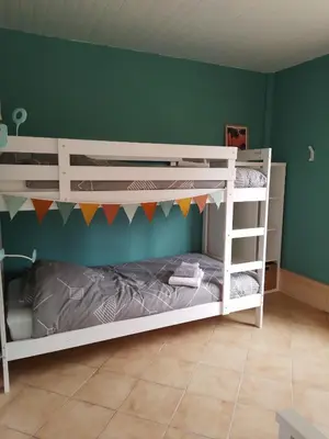 Un ou plusieurs lits dans un hébergement de l'établissement Chalet proche océan
