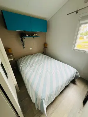 Un ou plusieurs lits dans un hébergement de l'établissement MH 142B Camping 