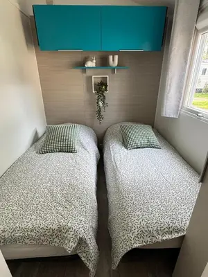 Un ou plusieurs lits dans un hébergement de l'établissement MH 142B Camping 