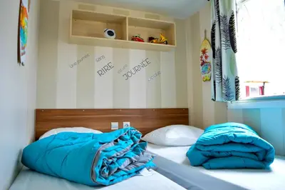 Un ou plusieurs lits dans un hébergement de l'établissement Mobil-home Mick et Stefie