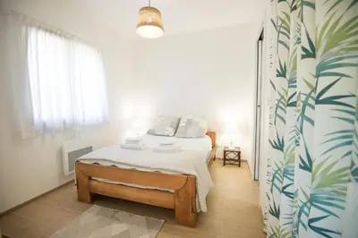Un ou plusieurs lits dans un hébergement de l'établissement Escapade à 2 Bassin Arcachon - jardin - WiFI