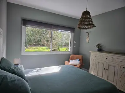 Un ou plusieurs lits dans un hébergement de l'établissement Chambre d'hôtes Landes - Le Clos des Oliviers