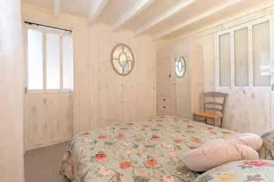 Un ou plusieurs lits dans un hébergement de l'établissement Charmant gîte cosy et romantique à Sanguinet