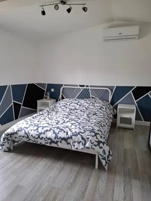 Un ou plusieurs lits dans un hébergement de l'établissement Ateka Dax appartement
