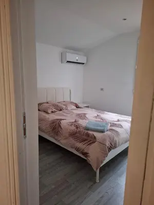 Un ou plusieurs lits dans un hébergement de l'établissement Ateka Dax appartement