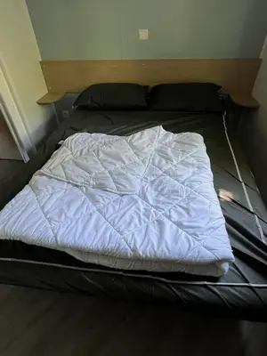 Un ou plusieurs lits dans un hébergement de l'établissement mobilhome 4 étoiles