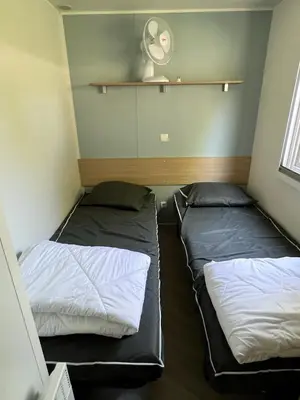 Un ou plusieurs lits dans un hébergement de l'établissement mobilhome 4 étoiles
