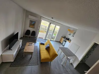 Télévision ou salle de divertissement dans l'établissement Appartement duplex Mimizan plage