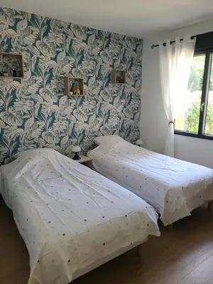 Un ou plusieurs lits dans un hébergement de l'établissement Maison avec piscine Pyla sur mer