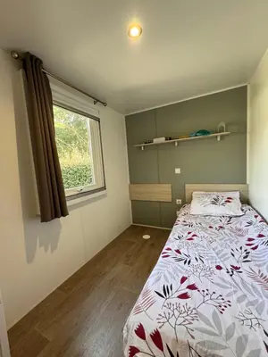 Un ou plusieurs lits dans un hébergement de l'établissement Bungalow à capbreton - Terrasse