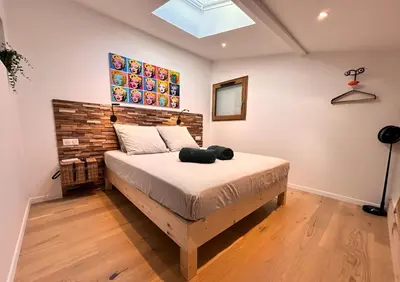 Un ou plusieurs lits dans un hébergement de l'établissement Appartement face à l'océan Chez Tao