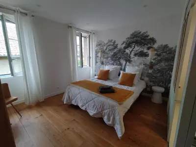 Un ou plusieurs lits dans un hébergement de l'établissement chambres d'hôtes numéro 2 Le Bedat côté jardin