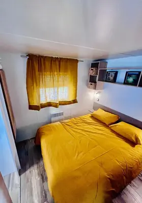Un ou plusieurs lits dans un hébergement de l'établissement Nature océan mobil-home