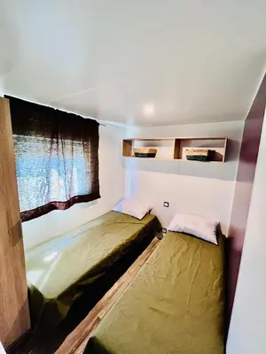Un ou plusieurs lits dans un hébergement de l'établissement Nature océan mobil-home