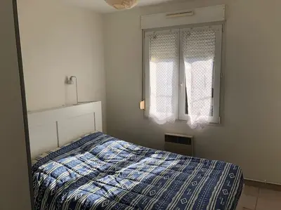 Un ou plusieurs lits dans un hébergement de l'établissement appartement la teste centre