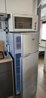 Cuisine ou kitchenette dans l'établissement Location Mobilhome 3ch Mimizan Plage