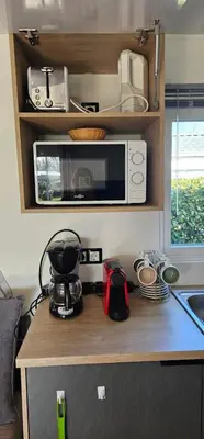 Cuisine ou kitchenette dans l'établissement Location Mobilhome 3ch Mimizan Plage