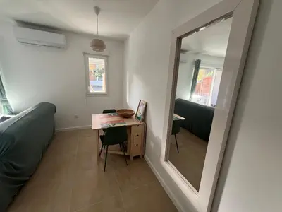 Coin salon dans l'établissement Appartement rez-de-chaussée