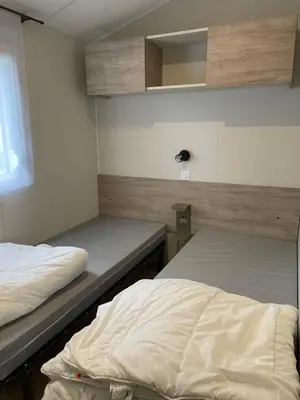 Un ou plusieurs lits dans un hébergement de l'établissement Mobilhome