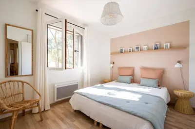 Un ou plusieurs lits dans un hébergement de l'établissement Villa Camélia à deux pas de la plage PYLA SUR MER