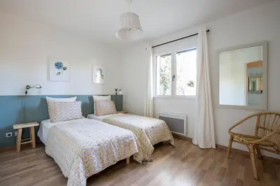 Un ou plusieurs lits dans un hébergement de l'établissement Villa Arbousière à deux pas de la plage PYLA SUR MER