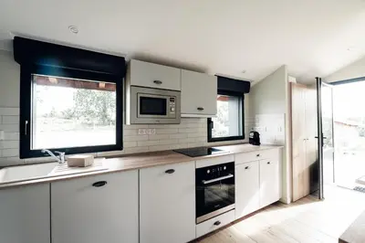 Cuisine ou kitchenette dans l'établissement Maison des Dunes