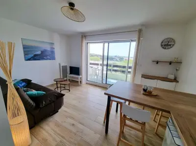 Coin salon dans l'établissement Les Landais-Appart cosy centre Mimizan plage 4p