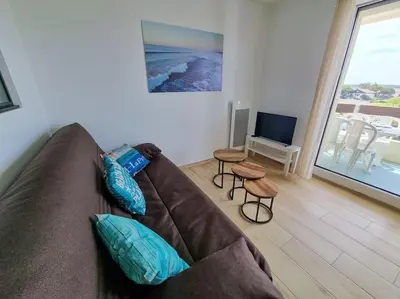 Coin salon dans l'établissement Les Landais-Appart cosy centre Mimizan plage 4p