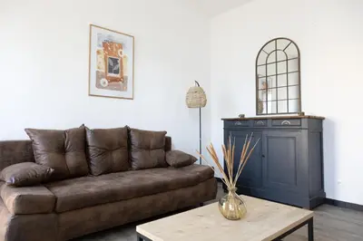 Coin salon dans l'établissement Maison COSY et CHALEUREUSE au centre ville