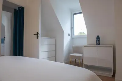 Un ou plusieurs lits dans un hébergement de l'établissement Appartement moderne avec parking