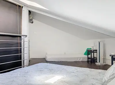 Un ou plusieurs lits dans un hébergement de l'établissement Appartement proche de la plage