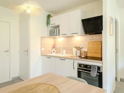Cuisine ou kitchenette dans l'établissement Appart cosy sunset