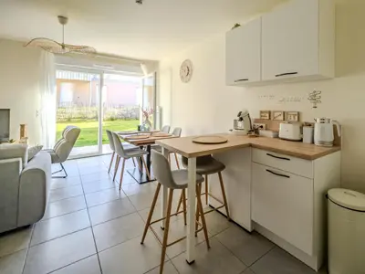 Cuisine ou kitchenette dans l'établissement Appart cosy sunset