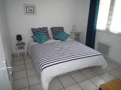 Un ou plusieurs lits dans un hébergement de l'établissement Bassin d'Arcachon Maison au calme