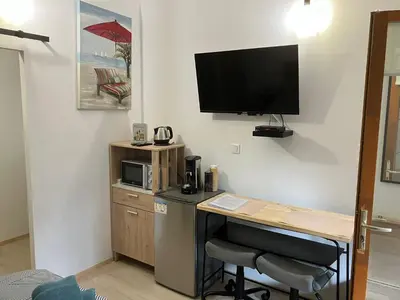 Cuisine ou kitchenette dans l'établissement Charmante chambre indépendante, terrasse et entrée privative