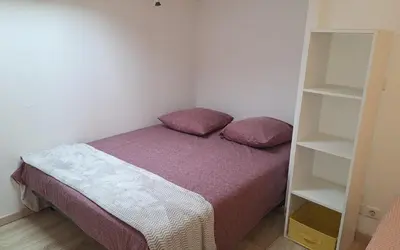 Un ou plusieurs lits dans un hébergement de l'établissement Maison Centre ville avec Jacuzzi