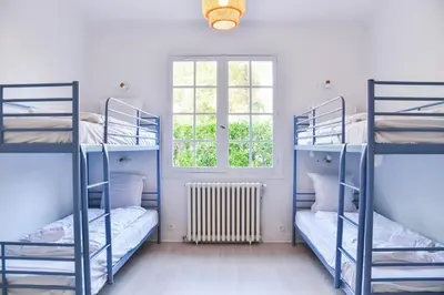 Un ou plusieurs lits dans un hébergement de l'établissement Maison du golf proche centre, lac et plages