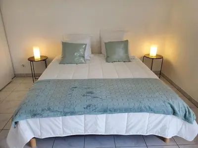 Un ou plusieurs lits dans un hébergement de l'établissement Appartement Le Boïate