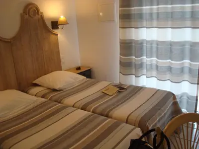 Un ou plusieurs lits dans un hébergement de l'établissement Chambres 