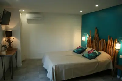 Un ou plusieurs lits dans un hébergement de l'établissement Chambres d'hotes Les sables Blancs