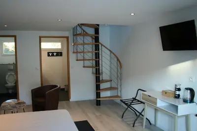 Un ou plusieurs lits dans un hébergement de l'établissement Chambres d'hotes Les sables Blancs