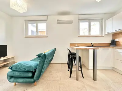 Cuisine ou kitchenette dans l'établissement L'Esplanade - Confort & Lumineux