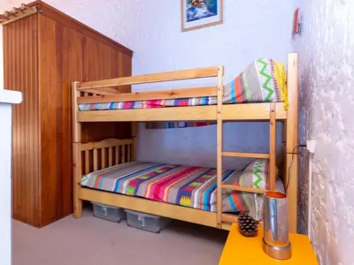 Un ou plusieurs lits dans un hébergement de l'établissement Studio en Duplex sous la Pinède et Proche de la Plage - FR-1-239-394