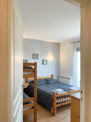Un ou plusieurs lits dans un hébergement de l'établissement Appartement familial proche des plages
