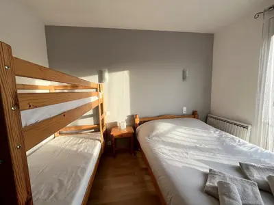 Un ou plusieurs lits dans un hébergement de l'établissement Appartement familial proche des plages