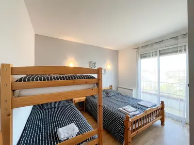 Un ou plusieurs lits dans un hébergement de l'établissement Appartement familial proche des plages