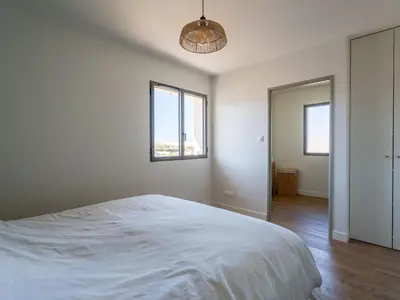 Un ou plusieurs lits dans un hébergement de l'établissement Maison neuve proche océan, terrasse, parking, 8 pers - FR-1-319-585