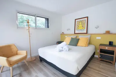 Un ou plusieurs lits dans un hébergement de l'établissement La Villa Nature Canopée du Lac